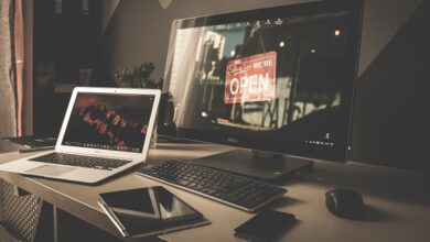 Desktop computer, laptop, tablet and mobile phone a desk in a home office