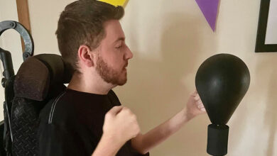 Ross is exercising using a punch bag