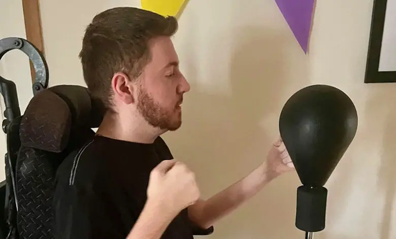 Ross is exercising using a punch bag