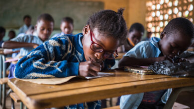 A group of girls are sitting in a classroom in Zambia