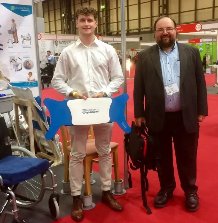 Disability Horizons Shop manager Duncan Edwards with Bradley Buckingham at Naidex launching the Glideboard 