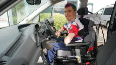 Paralympian David Smith sat in the driver's seat in his wheelchair in the new Sirus VW Caddy Maxi Life 5 wearing a Team GB t-shirt