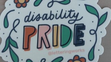 'Disability pride' sticker with pride in capital letters and the words surrounded by flowers