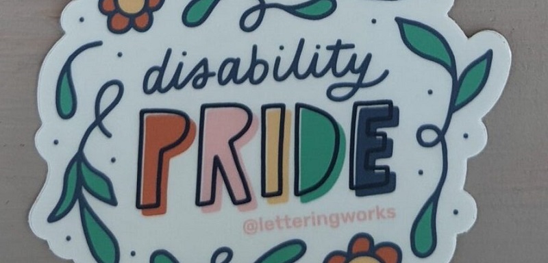 'Disability pride' sticker with pride in capital letters and the words surrounded by flowers