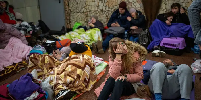People rest in the Kyiv subway, using it as a bomb shelter in Kyiv, Ukraine, Thursday, Feb. 24, 2022. AP Photo/Emilio Morenatti
