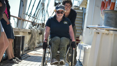 A woman in a wheelchair on the Jubilee Sailing Trust's fully-accessible ship