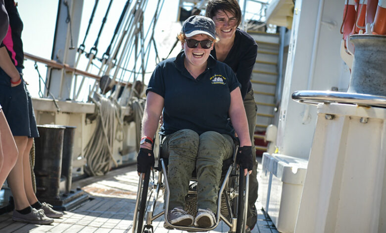 A woman in a wheelchair on the Jubilee Sailing Trust's fully-accessible ship