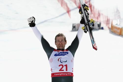 Adam Hall celebrating on the ski slope