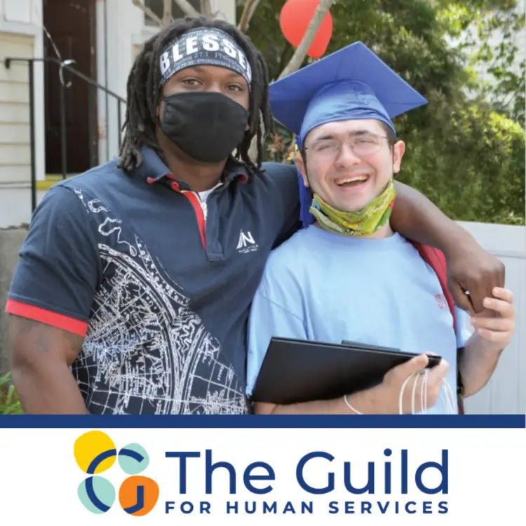Residential Manager Reggie Surpris with student TJ Sheppard with a graduation cap on at The Guild for Human Services