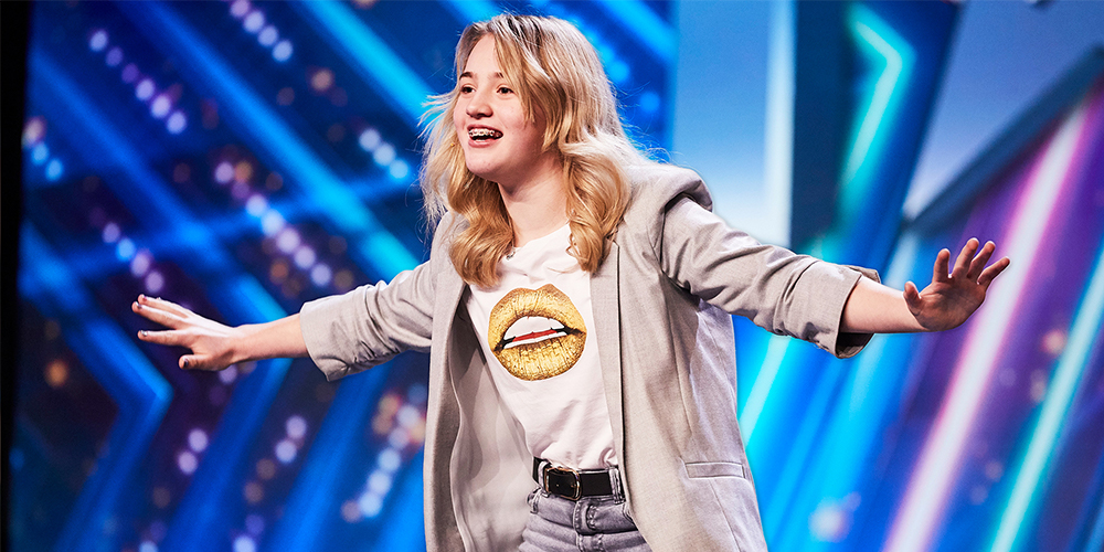 Eva Abley on Britain's Got Talent stage with arms stretched out to each side