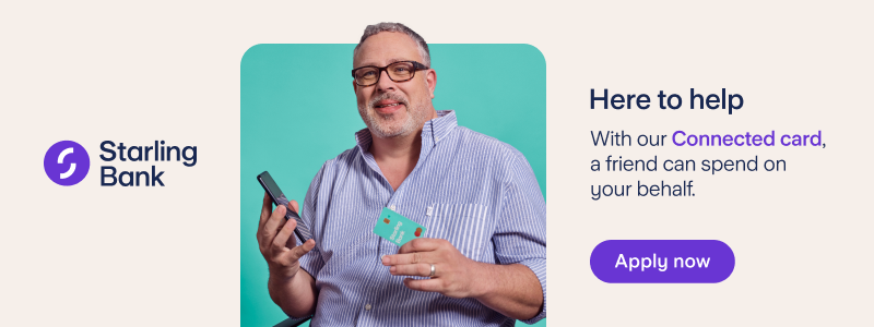An older man with a grey beard and hair, black glasses and a lilac shirt, sat in a wheelchair holding a mobile phone and a Starling Bank card. Words either side of the image read 'Starling Bank' and 'Here to help. With our Connected card, a friend can spend on your behalf. Apply now'.