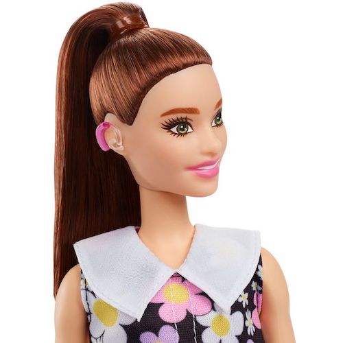 Close up of Barbie doll with hearing aids