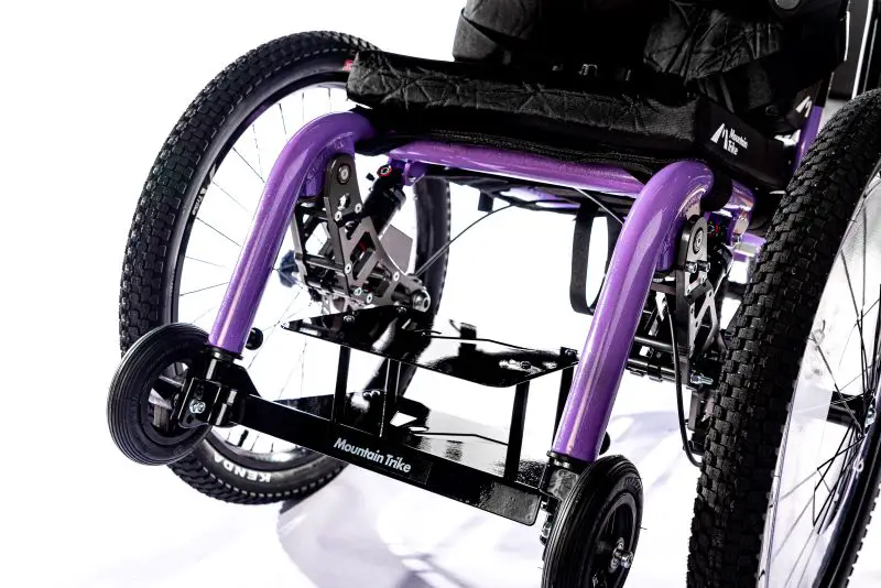 A close up of a footplate riser on a Mountain Trike all-terrain wheelchair