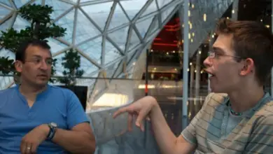 Nath speaking to client under a roof top