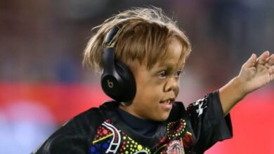 Quaden Bayles wearing headphones