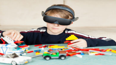 Boy Playing with Building Blocks wearing his eSight Device