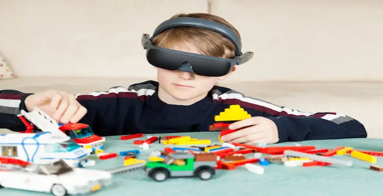 Boy Playing with Building Blocks wearing his eSight Device