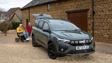 Dacia Jogger Wheelchair-Accessible Car in driveway with whelchair user and able-bodied person next to it