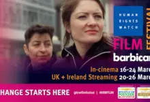 A head and shoulders shot of two women. The txt reads Human Rights Watch Film Festival. Barbican. In cinemas 16th - 24th March. UK and Ireland Streaming 20th to 26th March
