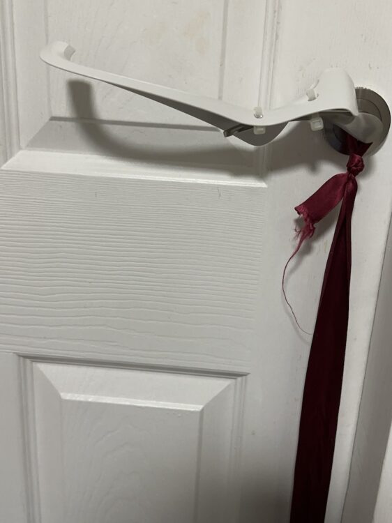 Photo of Tru Grip sliding off the handle of my bedroom door
