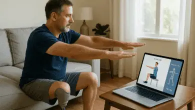 A middle-aged man with a prosthetic leg does guided home rehab exercises while following instructions on a tablet with AI motion tracking in a bright, modern living room.