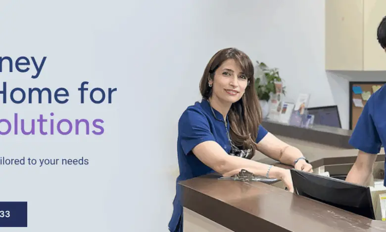 Three dental staff smiling at the front desk of Haven Dental, promoting gentle and modern dentistry.