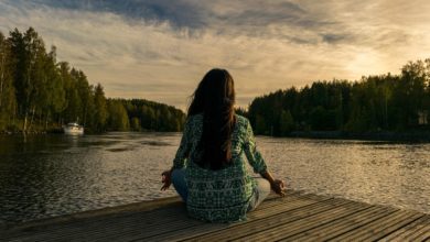 woman on a pier mediating