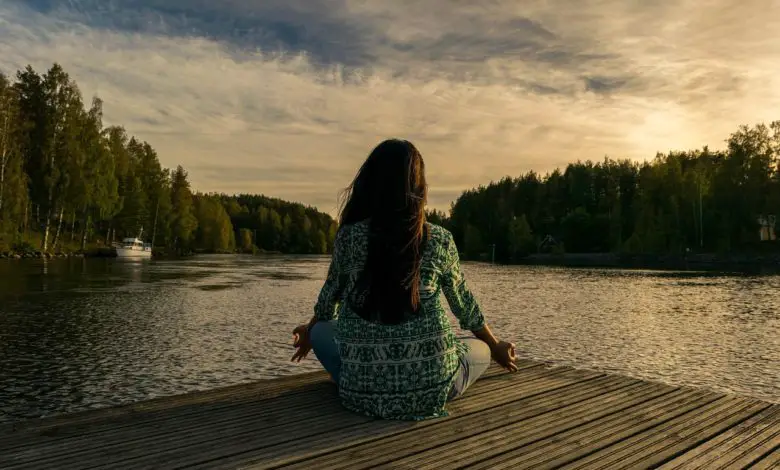 woman on a pier mediating
