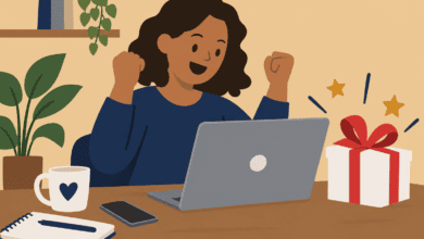 Woman celebrates winning an online competition, with a laptop and wrapped prize on the table.